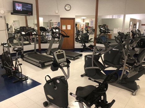 Picture of the Physical Therapy Gym. There is treadmills and exercise bikes.